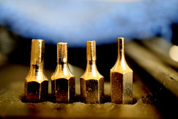 Four drill bits in a row.