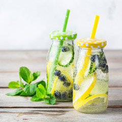 Fresh cool lemon cucumber berry infused water detox drink