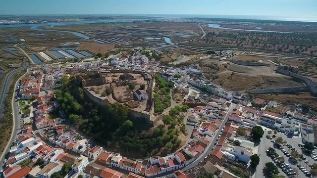 Aerial. The village of Castro Marim and the castle, filmed from sky drone.
