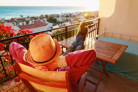 young man relax on scenic balcony terrace