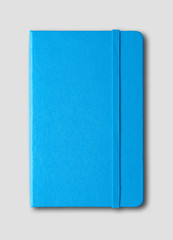 blue closed notebook isolated on grey