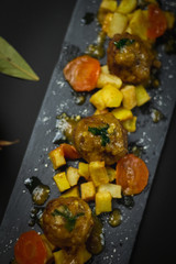 pork and beef meatballs in onion and carrot sauce with potatoes