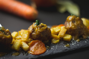 pork and beef meatballs in onion and carrot sauce with potatoes