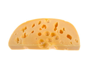 a slice of cheese with large holes on a white background
