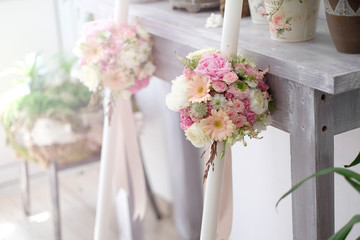 Baptismal white candles. Baptismal white candles with floral arrangement for special events.