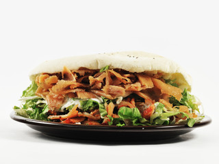 Sandwich with beef and chicken meat. Big sandwich on the plate isolated on the white background.