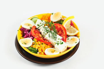 Organic salad. Diet food made from boiled eggs, tomatoes, corn good for breakfast isolated on the white background.