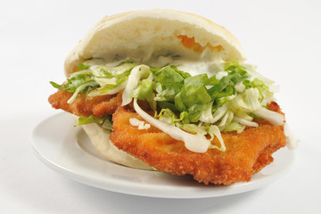 Healthy sandwich. Big sandwich with chicken meat isolated on the white background.