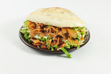 Big sandwich. Sandwich with beef and chicken meat isolated on the white background.