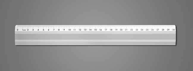 Metal ruler isolated on dark grey background
