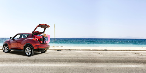 Fototapeta na wymiar summer car on road and sea landscape 