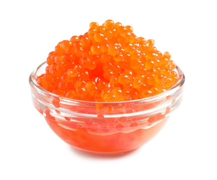 Bowl with delicious red caviar on white background