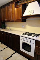White stove in the kitchen. Classic kitchen from house with different accessories.
