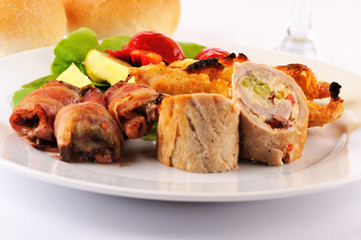 Romanian traditional food. Wedding appetizer food on the white plate isolated on the white background.