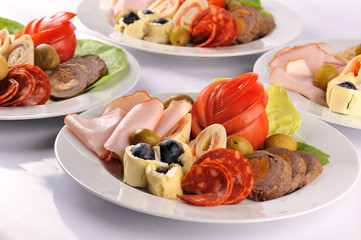 Appetizer food for wedding event. Plates with different types of meat for wedding reception event.