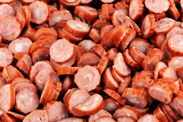 Pork salami. Closeup of small pork salami slices.