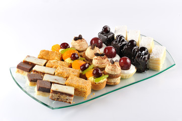 Delicious cookies on the glass plate good to serve for different public events.