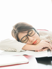 Teenage girl short hair sleep on desk after working