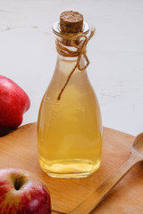Apple vinegar. Bottle of apple organic vinegar on a white background. Healthy organic food.