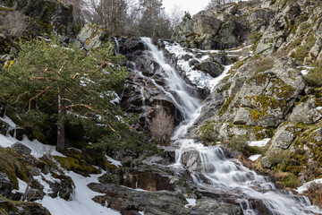 Waterfall from snow melt in the mountains of Madrid, Spain