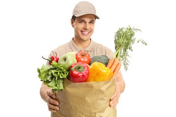 Delivery guy giving a bag of groceries