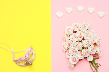 Pink and white roses, heart shape stones and face mask on flat lay paper, happy mothers day