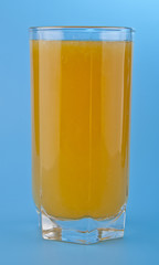 orange juice on a blue background