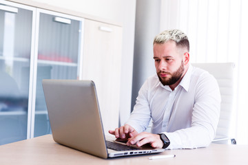 Young IT Engineer Working On Laptop