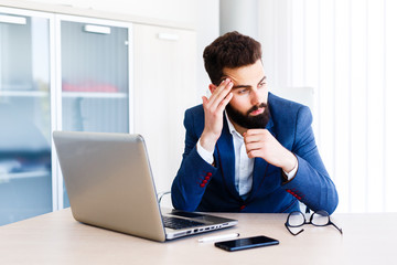 Young Handsome Businessman Has Headache
