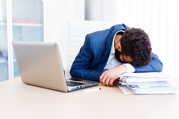 Young Sleepy Accountant Sitting At Workplace