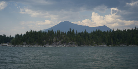 Lake with mountain range in the background, Kootenay Lake, British Columbia, Canada