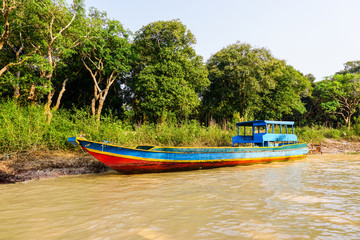 Fototapeta na wymiar Boat on a canal in Cambodia