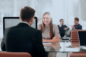 Woman working with her colleague in the office.