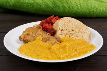 Sauce with seitan and dumplings on a table
