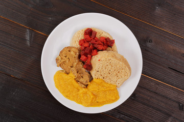 Sauce with seitan and dumplings on a table