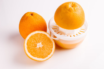 oranges and juice on a white background
