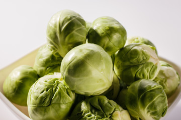 Brussels sprouts on a rustic wooden background