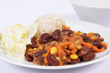 Red beans with corn and carrot, sorghum on a white