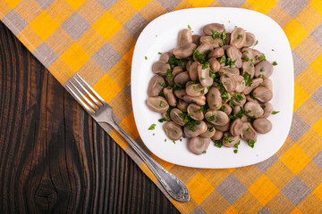 boiled broad beans on a rustic background