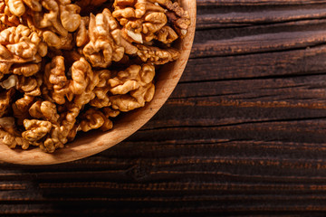 Walnut on a dark rustic wooden background
