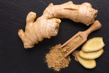 Ginger root on a dark stone background