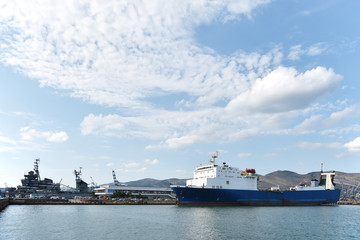 Obraz premium A big white blue ship. The ship is in the port. A ship for passengers and cargo