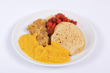 Sauce with seitan and dumplings on a on a white