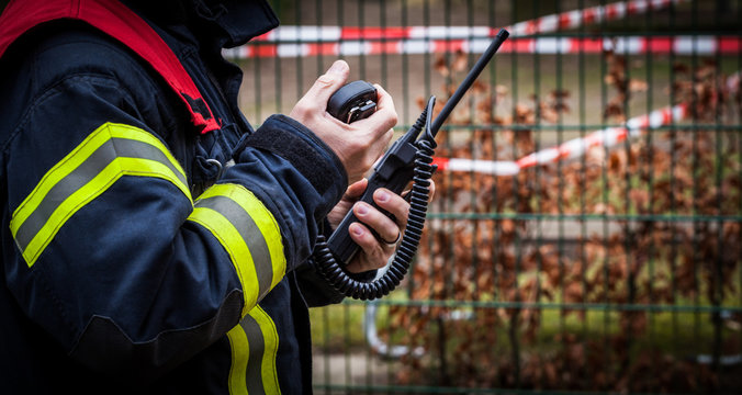 HDR - Feuerwehrmann im Einsatz mit Funkger&auml;t - Serie Feuerwehr 