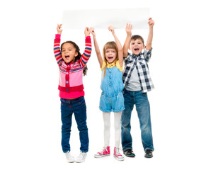 Obraz premium three children with open mouths holding empty sheet of paper