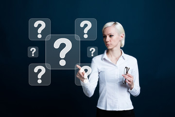 Businessman presses button question on virtual electronic user interface.
