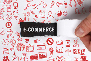 The concept of business, technology, the Internet and the network. Young businessman showing inscription: E-commerce