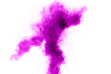 Violet color powder explosion cloud isolated on white background.Closeup of purple dust particles splash isolated on  background.