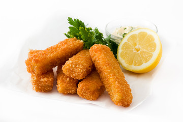crispy fried fish fingers with lemon and sauce isolated on white background