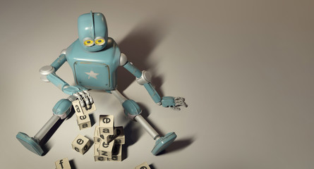 Retro Robot plays with wooden ABC cubes on floore. 3D rendering. Education scientist robot student